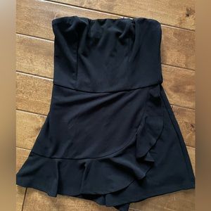 Lulu’s Call Me Up Black Ruffled Strapless Skort Romper